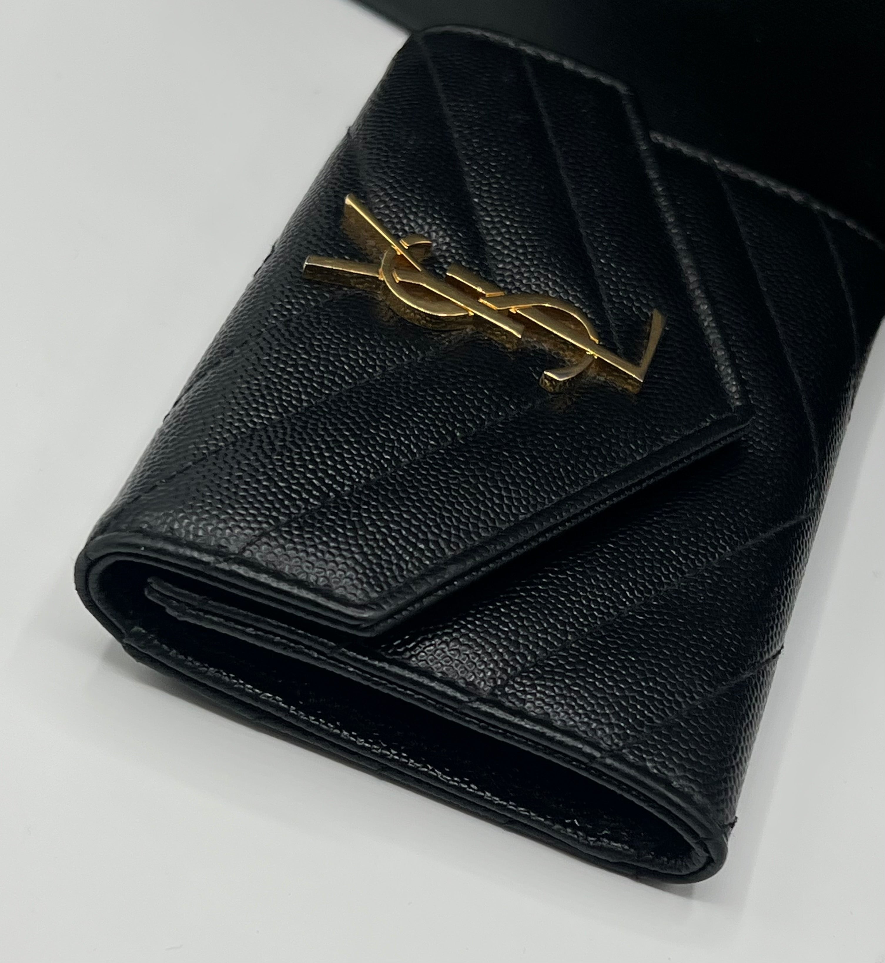 Saint Laurent - portefeuille Cassandre noir YSL doré