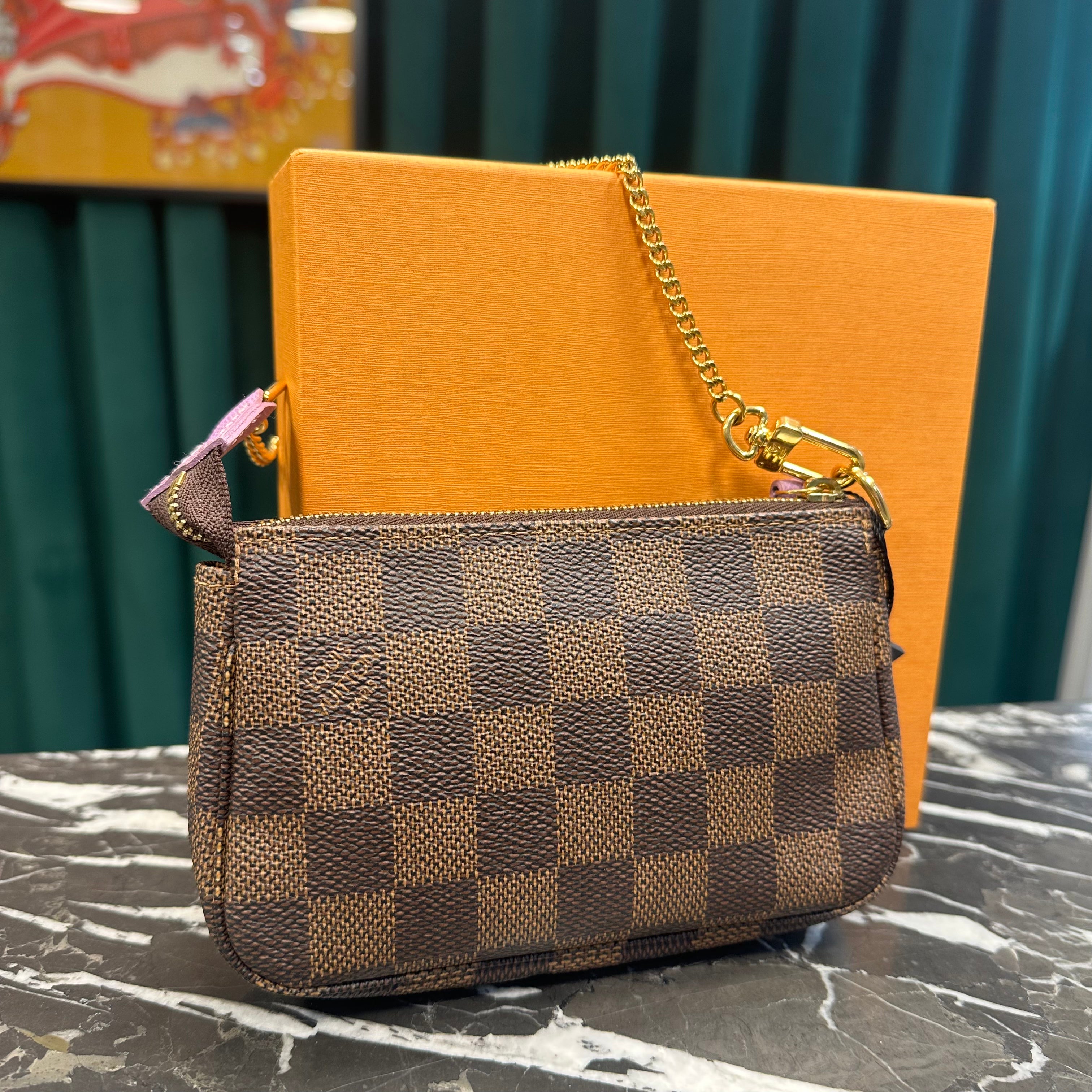 Louis Vuitton - Pochette Mini Accessoires