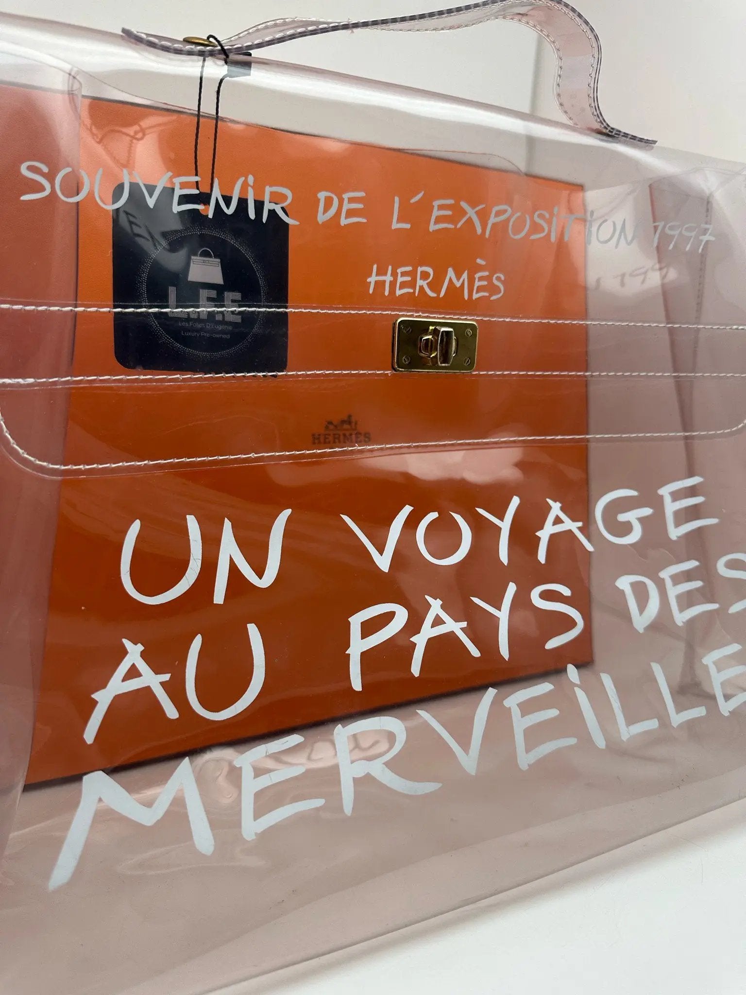 Un voyage au pays des merveilles bag clearance fake